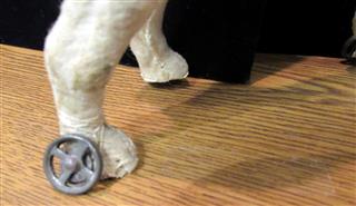 RARE ANTIQUE LATE 1800'S MOLDED CARDBOARD SPOTTED DOG W/GLASS EYES ON WHEELS